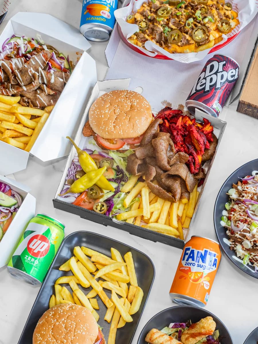A Kebys spread — doner kebab, burgers, pizza, loaded fries and drinks